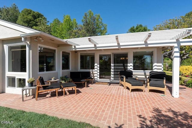 back of house with a pergola, a patio area, outdoor lounge area, and stucco siding