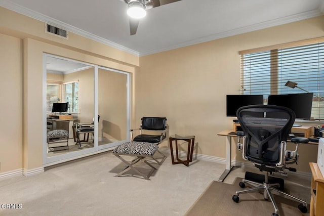 home office featuring carpet floors, ceiling fan, crown molding, and baseboards