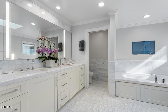 bathroom featuring toilet, crown molding, tile patterned flooring, tile walls, and double vanity