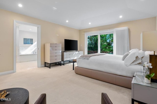 carpeted bedroom with recessed lighting, baseboards, and ensuite bathroom
