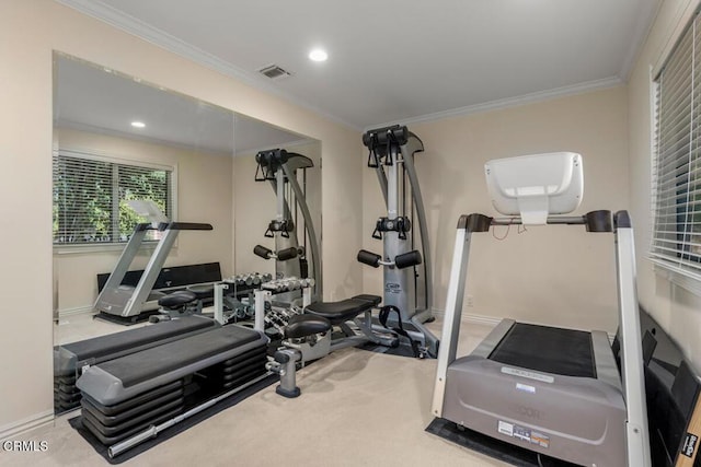 exercise area featuring ornamental molding, baseboards, and recessed lighting
