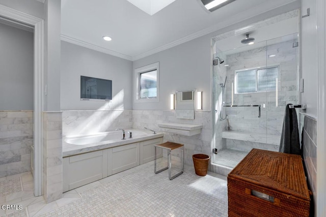bathroom featuring tile walls, healthy amount of natural light, ornamental molding, a marble finish shower, and tile patterned floors