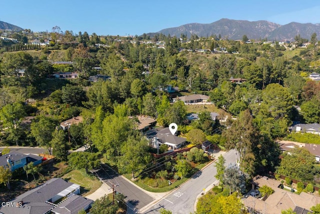 aerial view of property's location with a mountain backdrop