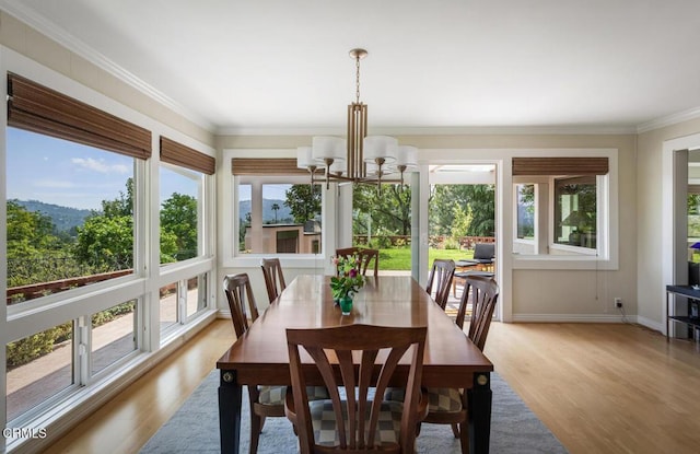5109 Redwillow Ln, La Canada Flintridge, CA 91011 - dining room featuring a chandelier, light wood finished floors, and crown molding