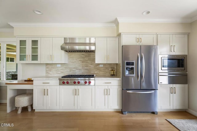 5109 Redwillow Ln, La Canada Flintridge, CA 91011 - kitchen with stainless steel appliances, wall chimney exhaust hood, a warming drawer, crown molding, and light countertops