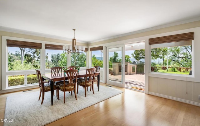 5109 Redwillow Ln, La Canada Flintridge, CA 91011 - dining space featuring a chandelier, wood finished floors, and crown molding