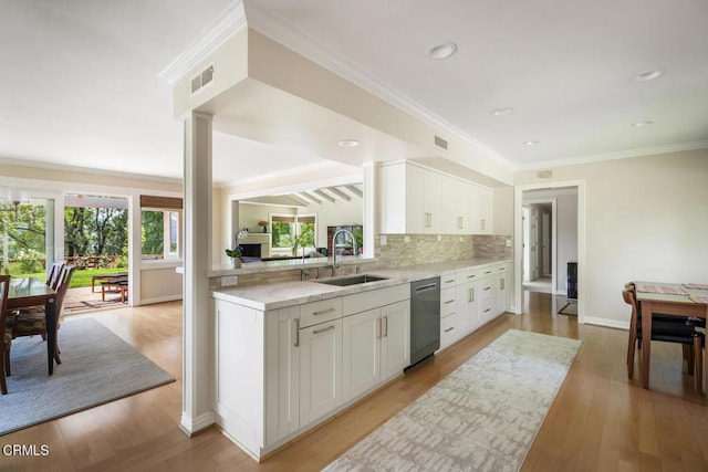 5109 Redwillow Ln, La Canada Flintridge, CA 91011 - kitchen featuring dishwasher, decorative backsplash, white cabinetry, light wood finished floors, and ornamental molding