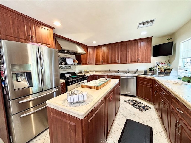 7442 Camarilla Ave, Yucca Valley, CA 92284 - kitchen with appliances with stainless steel finishes, a sink, exhaust hood, light tile patterned floors, and light countertops