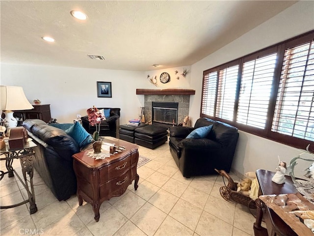 7442 Camarilla Ave, Yucca Valley, CA 92284 - living area with light tile patterned floors, recessed lighting, and a fireplace