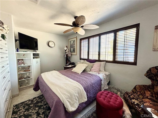 7442 Camarilla Ave, Yucca Valley, CA 92284 - bedroom with a ceiling fan and light tile patterned flooring