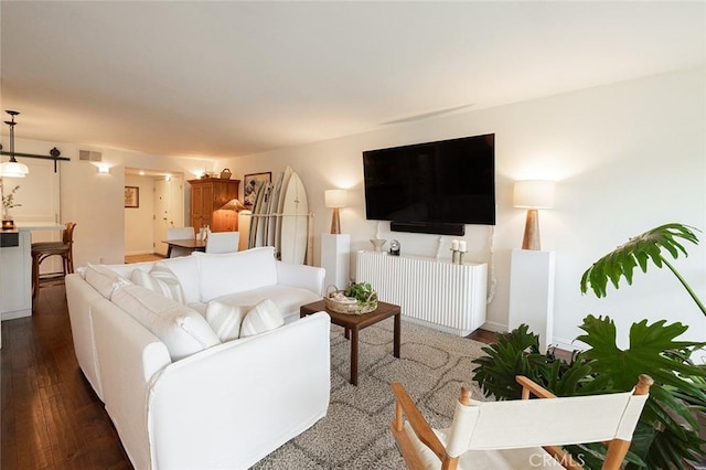 living room with wood finished floors and baseboards