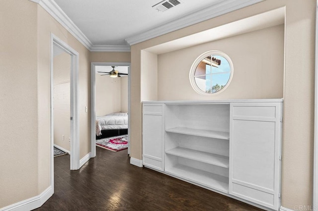 corridor featuring crown molding, baseboards, and dark wood-style flooring