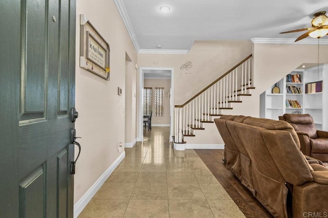 foyer entrance with ornamental molding, baseboards, ceiling fan, stairway, and recessed lighting