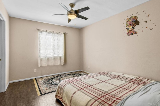 bedroom with wood finished floors, baseboards, and ceiling fan