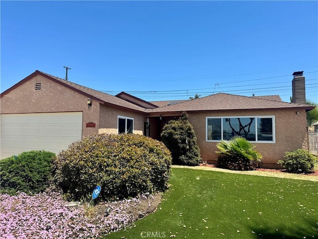 ranch-style home with an attached garage, stucco siding, and a front yard