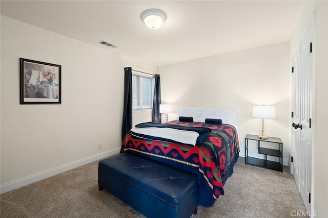 bedroom with carpet floors and baseboards