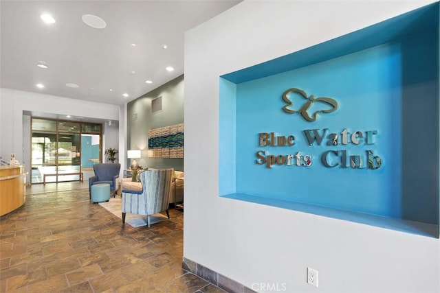 24247 Songsparrow Ln, Corona, CA 92883 - hallway with stone finish flooring and recessed lighting
