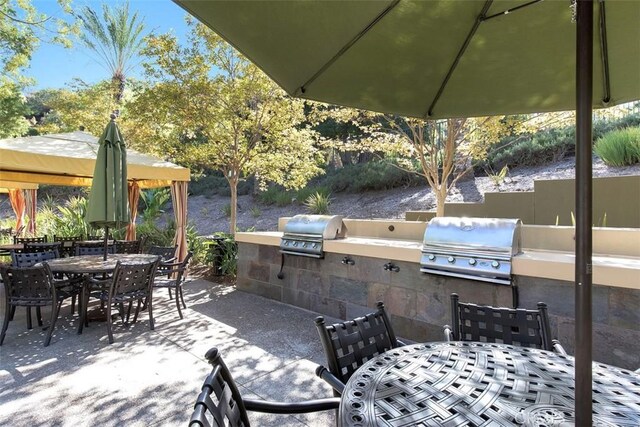 24247 Songsparrow Ln, Corona, CA 92883 - view of patio / terrace with outdoor dining space, a grill, exterior kitchen, and a gazebo