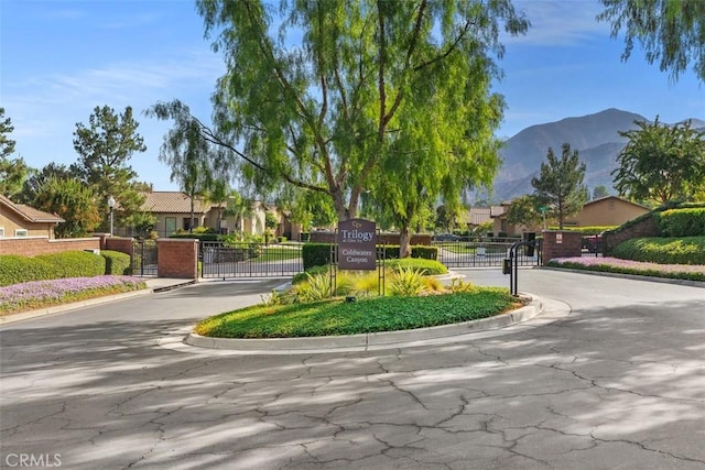24247 Songsparrow Ln, Corona, CA 92883 - view of community featuring a gate, a mountain view, and a residential view
