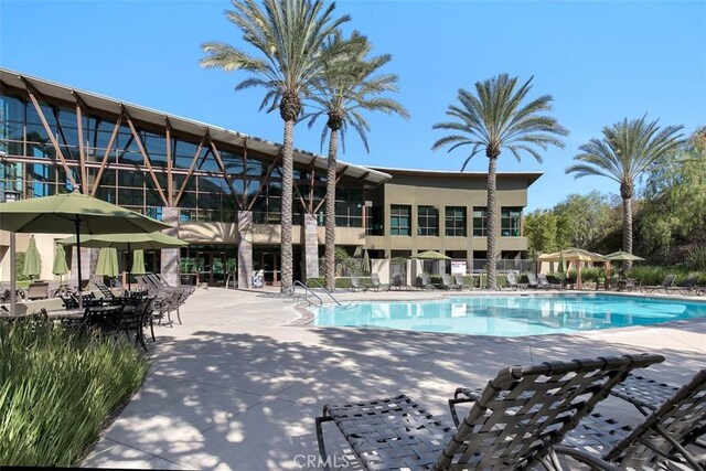 24247 Songsparrow Ln, Corona, CA 92883 - community pool featuring a patio area