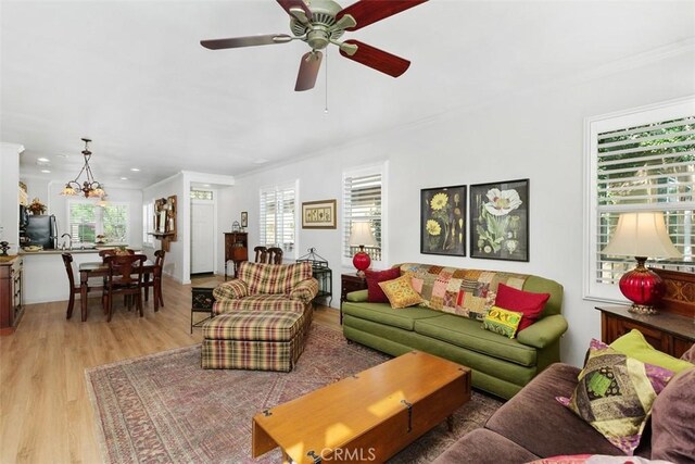 24247 Songsparrow Ln, Corona, CA 92883 - living area featuring ornamental molding, light wood-style floors, a ceiling fan, and recessed lighting