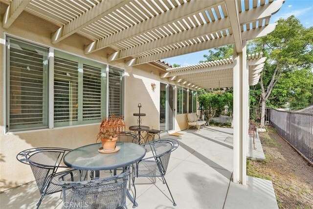 24247 Songsparrow Ln, Corona, CA 92883 - view of patio / terrace with a fenced backyard, a pergola, and outdoor dining space