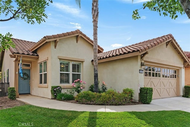 24247 Songsparrow Ln, Corona, CA 92883 - mediterranean / spanish home with a garage, concrete driveway, a tile roof, stucco siding, and a front lawn