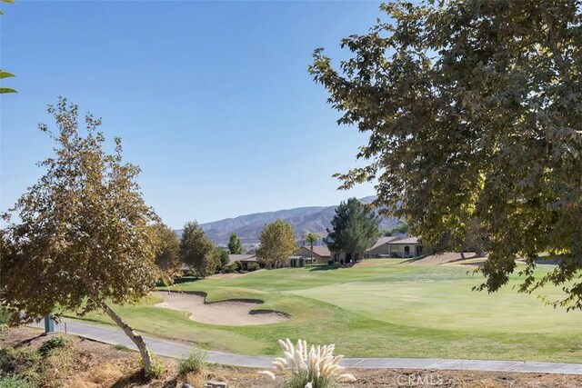 24247 Songsparrow Ln, Corona, CA 92883 - surrounding community featuring a mountain view, a lawn, view of golf course, and a residential view
