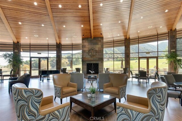24247 Songsparrow Ln, Corona, CA 92883 - building lobby with a towering ceiling, floor to ceiling windows, wooden ceiling, and beam ceiling
