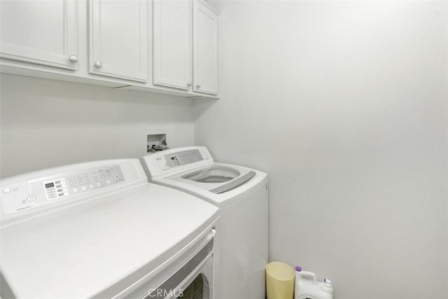 24247 Songsparrow Ln, Corona, CA 92883 - clothes washing area with washer and clothes dryer and cabinet space