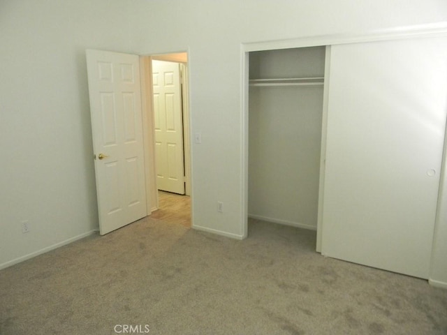 613 Big Spring Dr, Banning, CA 92220 - unfurnished bedroom featuring carpet, a closet, and baseboards