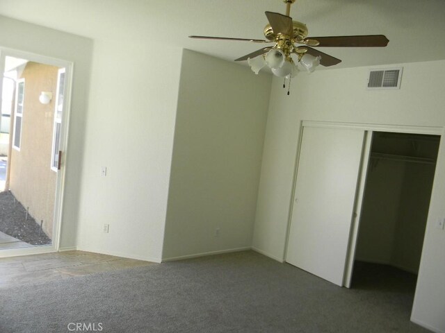 613 Big Spring Dr, Banning, CA 92220 - unfurnished bedroom featuring carpet floors, a closet, and ceiling fan