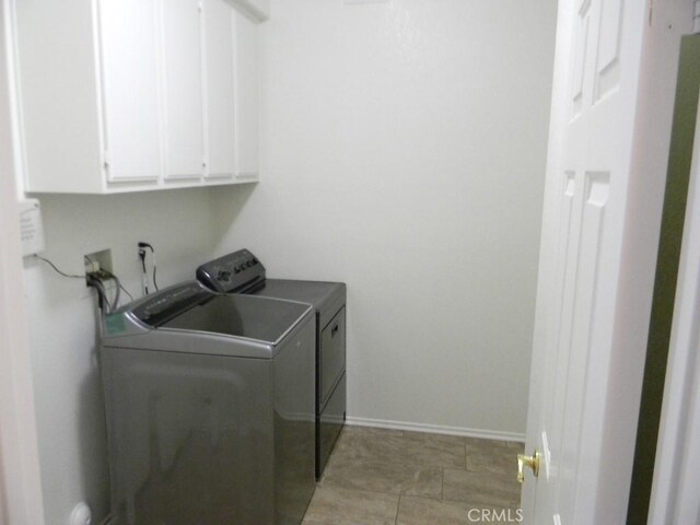 613 Big Spring Dr, Banning, CA 92220 - washroom with washing machine and dryer, cabinet space, and baseboards