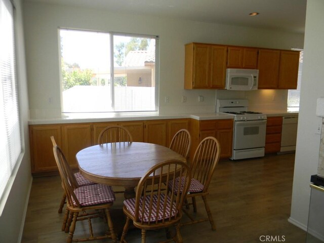 613 Big Spring Dr, Banning, CA 92220 - kitchen featuring white appliances, wood finished floors, and light countertops