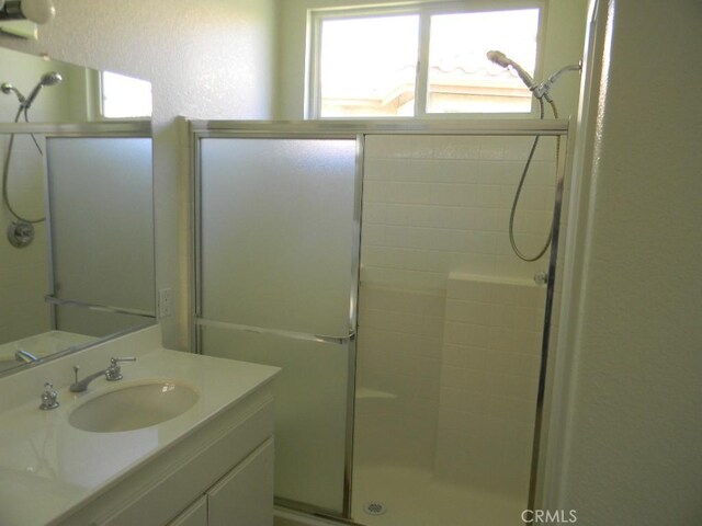 613 Big Spring Dr, Banning, CA 92220 - bathroom with a stall shower and vanity