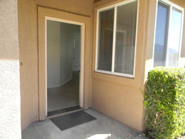 613 Big Spring Dr, Banning, CA 92220 - view of exterior entry featuring stucco siding