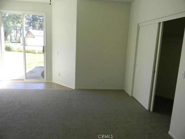 613 Big Spring Dr, Banning, CA 92220 - unfurnished bedroom with access to outside, carpet flooring, and a closet