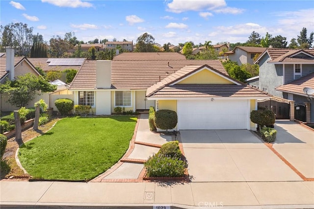 1029 Cogburn Ln, Diamond Bar, CA 91765 - view of front facade featuring a tiled roof, a garage, driveway, and a residential view