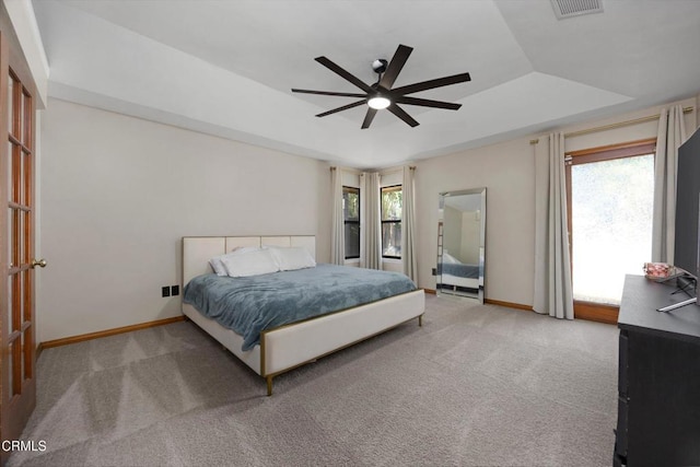 bedroom featuring multiple windows, carpet flooring, and baseboards