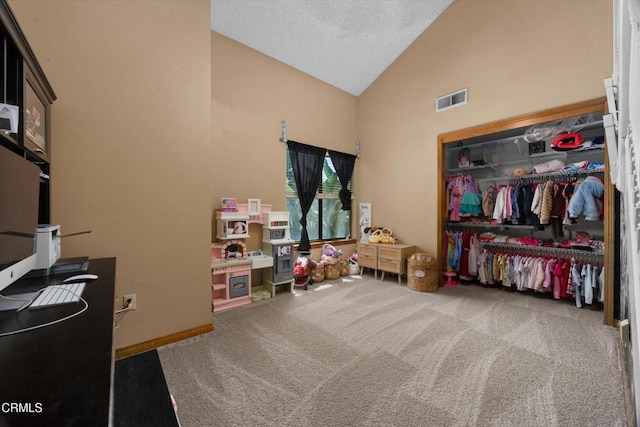 rec room with carpet flooring, high vaulted ceiling, and a textured ceiling