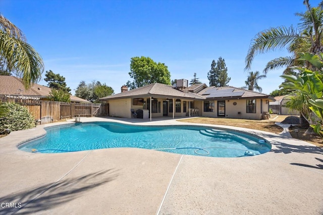 view of pool featuring a patio area and a fenced backyard