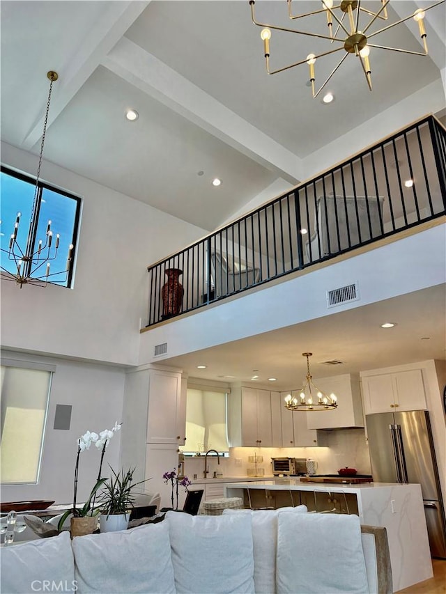 2621 Gates Ave Unit B, Redondo Beach, CA 90278 - living room featuring a chandelier, high vaulted ceiling, beamed ceiling, and recessed lighting