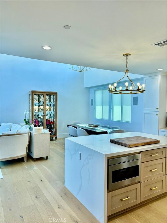 2621 Gates Ave Unit B, Redondo Beach, CA 90278 - kitchen featuring a chandelier, light wood finished floors, pendant lighting, open floor plan, and recessed lighting