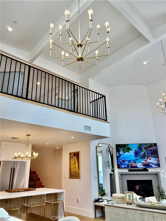 2621 Gates Ave Unit B, Redondo Beach, CA 90278 - living area with a chandelier, stairway, a high ceiling, beam ceiling, and recessed lighting