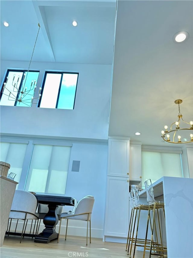 2621 Gates Ave Unit B, Redondo Beach, CA 90278 - dining space featuring a chandelier, recessed lighting, light wood-style floors, and baseboards