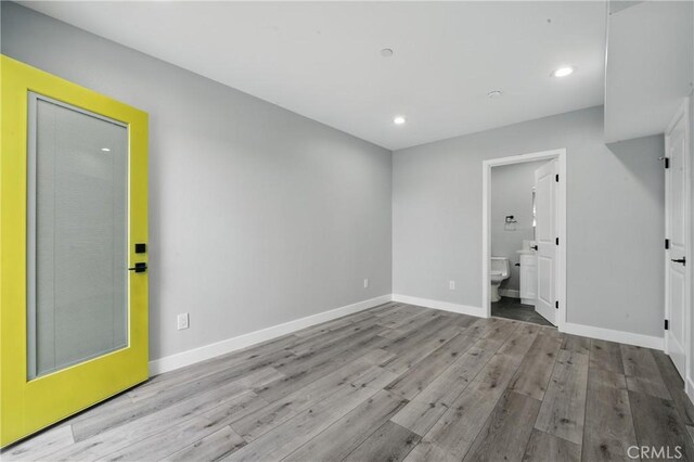 1643 W 82nd St, Los Angeles, CA 90047 - empty room featuring wood finished floors, baseboards, and recessed lighting