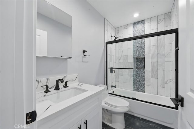 1643 W 82nd St, Los Angeles, CA 90047 - bathroom featuring combined bath / shower with glass door, toilet, vanity, and recessed lighting