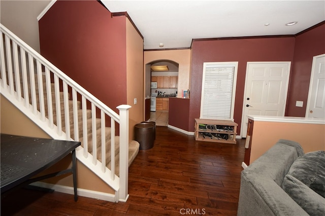 3509 E Berkshire Ct Unit C, Orange, CA 92869 - entryway featuring arched walkways, hardwood / wood-style floors, ornamental molding, baseboards, and stairway