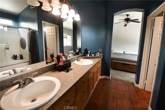 3509 E Berkshire Ct Unit C, Orange, CA 92869 - bathroom featuring connected bathroom, an enclosed shower, hardwood / wood-style flooring, a ceiling fan, and double vanity