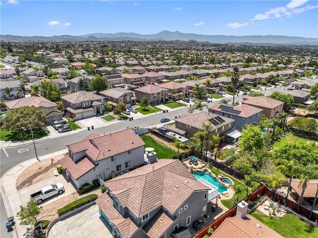 aerial view of residential area with a mountainous background